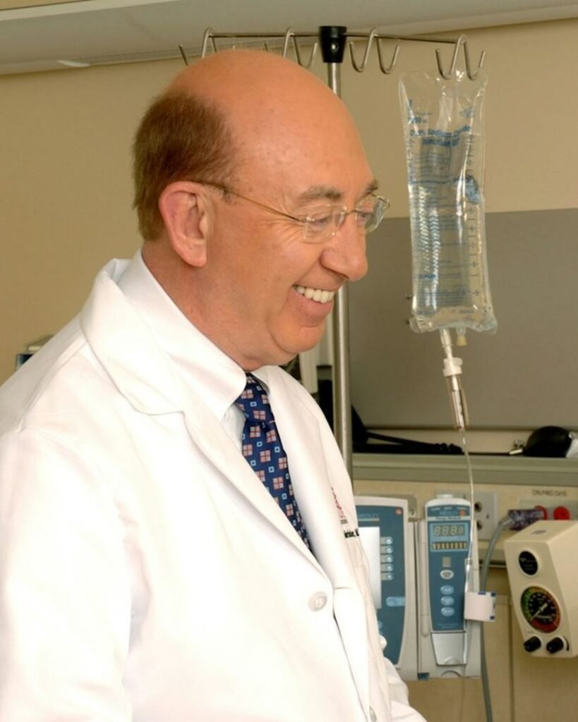 A smiling doctor in a white coat