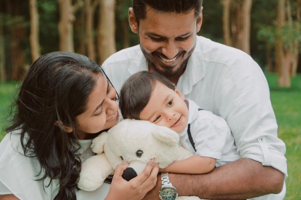Parents laughing with their young child