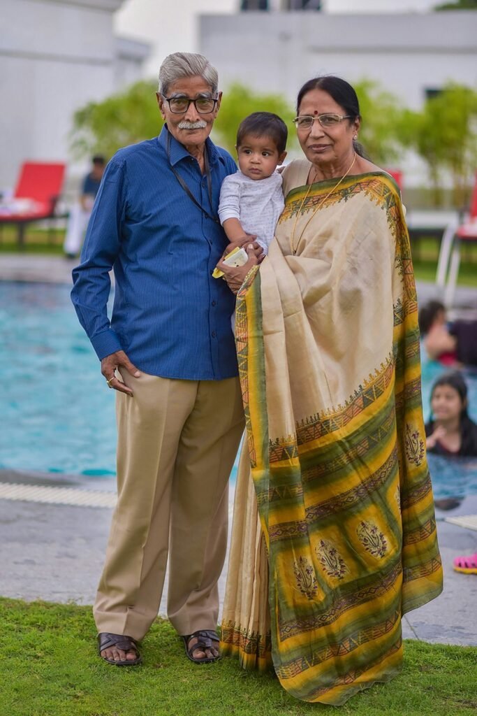 Grandparents holding their grandchild