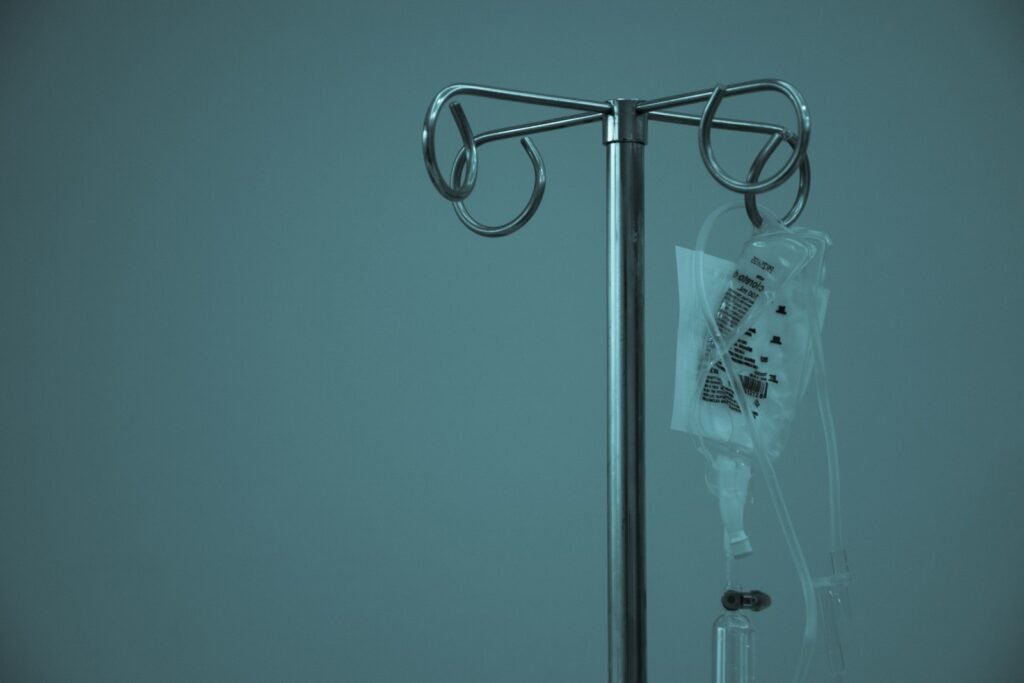 An intravenous drip stand in a hospital room