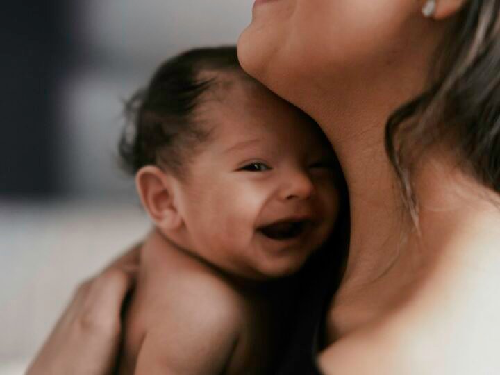 Mother smiling with her baby